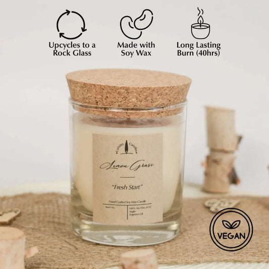 Candle with cork lid on a textured surface, featuring sustainability icons and text.